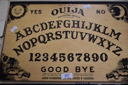 A vintage Ouija Board 'William Fuld Talking board set'.