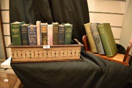Arts and crafts book shelf in oak having carved and poker work decoration, also three similar book