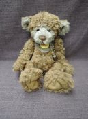A Charlie Bears Jointed Teddy bear named Parkin having plastic eyes, stitched nose and mouth, two