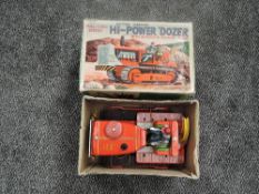 A 1960's Japanese TN Toys Nomura Battery Operated Hi-Power Dozer with automatic exhaust smoke, in