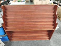 A wooden bespoke made display shelf unit having 12 shelves with turned finials, width 147cm,