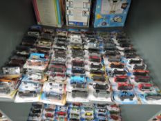 A shelf of 21st century Mattel Hot Wheels diecasts, mainly 2006 onwards, all in blister packs,