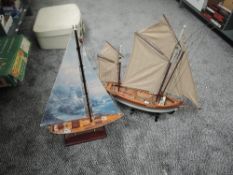 Two modern model Sail Boats, one named Thonier, both on stands