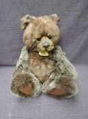 A Charlie Bears Jointed Teddy bear named Chester having plastic eyes, stitched nose and mouth, two