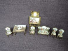 An early 20th century Austrian brass & enamel Dolls House Miniature Saloon Suite comprising Sofa,