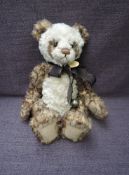 A Charlie Bears Jointed Teddy bear named Ellis having plastic eyes, stitched nose and mouth, two