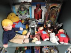 A shelf of modern Soft Toys, Robots and Dolls including Thinkway Buzz Lightyear in original box,
