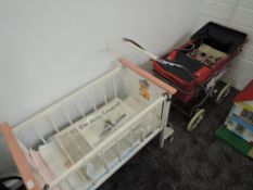 A vintage Silver Cross Dolls Pram in red leather with chrome frame along with a vintage Dolls wooden