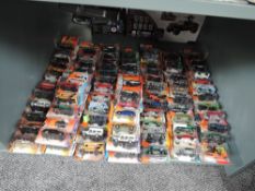 A shelf of 21st century Matchbox diecasts, mainly 2006 onwards, includes Hero and Adventure City