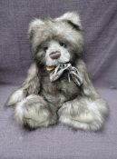 A Charlie Bears Jointed Teddy bear named Cooper having plastic eyes, stitched nose and mouth, two