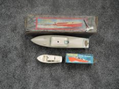 A Hornby clockwork Speed Boat No 5 Viking Cabin Cruiser, in original box along with a Penguin