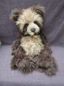 A Charlie Bears Jointed Teddy bear named George having plastic eyes, stitched nose and mouth,