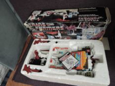 An original 1980's Hasbro Transformer, Autobot Battle Station Metroplex with instruction booklet and