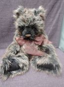 A Charlie Bears Jointed Teddy bear named Ballantyne having plastic eyes, stitched nose and mouth,