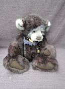 A Charlie Bears Jointed Teddy bear named Barney having plastic eyes, stitched nose and mouth, two