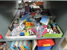 A shelf of modern figures and accessories including Cartoon Network, Superman, N-Power, Cube World