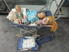 A Cumfifolda Sprite Dolls Pram having folding frame and solid rubber wheels, blue baseonet, canopy