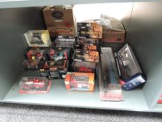 A shelf of modern diecasts including Corgi Fire Heroes, Maisto Motor Cycles, Train on plinth etc,