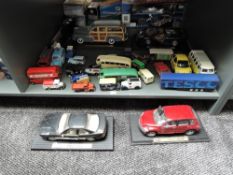 A shelf of modern diecasts including Maisto 1:18 scale 1948 Chevrolet Fleetmaster, BMW 850I. Chysler