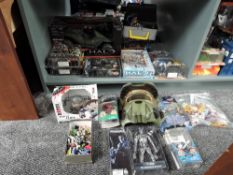 A shelf of modern figures and accessories including Halo, Terminator 2, Mag Warriors etc, on
