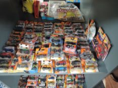 A shelf of 21st century Matchbox diecasts, mainly 2006 onwards, includes Best of British series, all
