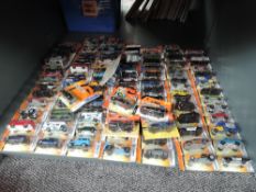A shelf of 21st century Matcbox diecasts, mainly 2006 onwards, Superfast and Bonus series