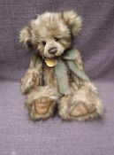 A Charlie Bears Jointed Teddy bear named Lita having plastic eyes, stitched nose and mouth, two tone
