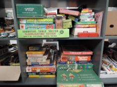 Two shelves of vintage Toys and Games including Munro International Football, Palitoy League