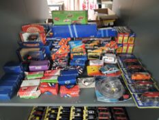 A shelf of mixed vintage Corgi diecasts 1980's and later, all boxed approx 60