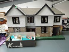 A vintage wooden two storey Dolls House having tin plate windows on wooden base along with Spot On