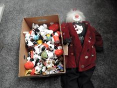 A shelf of Snoopy figures and collectables along with a modern Hobo limited edition Clown doll named