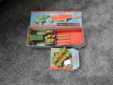 A Mettoy tin pate Mechanical Tractor and Trailer, boxed and a Mettoy tin plate Disc Harrow, also