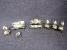 An early 20th century Austrian brass & enamel Dolls House Miniature Saloon Suite comprising Sofa,
