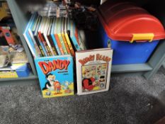A shelf containing 17 Beano, Dandy, Beezer and simalar Annuals including 1983 Dandy, 1984 Beano,