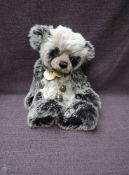 A Charlie Bears Jointed Teddy bear named Higgins having plastic eyes, stitched nose and mouth, two