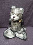 A Charlie Bears Jointed Teddy bear named Talitha having plastic eyes, stitched nose and mouth, two