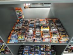 A shelf of 21st century Matchbox diecasts including Aeroplanes, all in blister packs, appprox 140