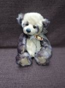 A Charlie Bears Jointed Teddy bear named Samantha having plastic eyes, stitched nose and mouth,