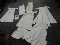 A good amount of antique children's and babies clothing to include quilted bib, christenings dresses
