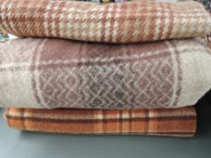 Three vintage rugs in autumnal tones.
