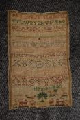 A George III sampler dated 1781, worked by Hannah Rider, using animals, numbers and alphabet.