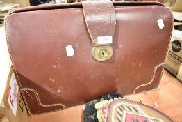 A leather bound satchel or bag