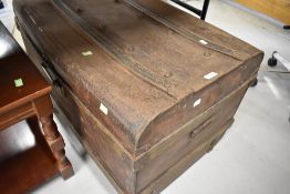 A large grained metal tin trunk or case