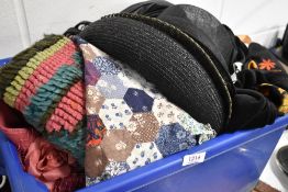 A selection of textiles and ladies hats