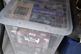 A selection of cow boy and John Wayne VHS video tapes
