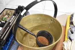 A large brass jam pan and similar sauce pot