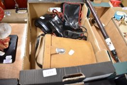 A pair of Cosmo Super binoculars 10x50 field with case and a Nikon camera