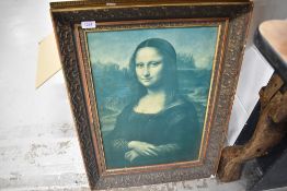 A print of the Mona Lisa in gesso frame