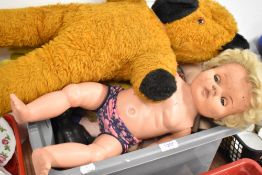 A selection of vintage and retro dolls, teddies and wooden dolls house furniture.