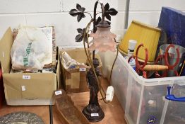 A bronze effect figural lamp base with rose light shade